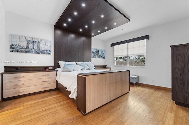 bedroom with light hardwood / wood-style floors