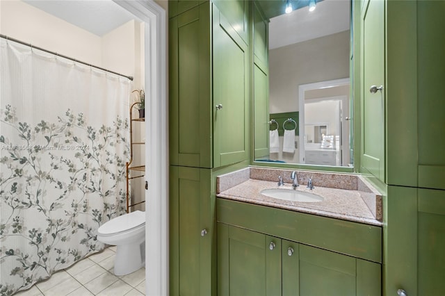 bathroom with tile patterned flooring, vanity, curtained shower, and toilet