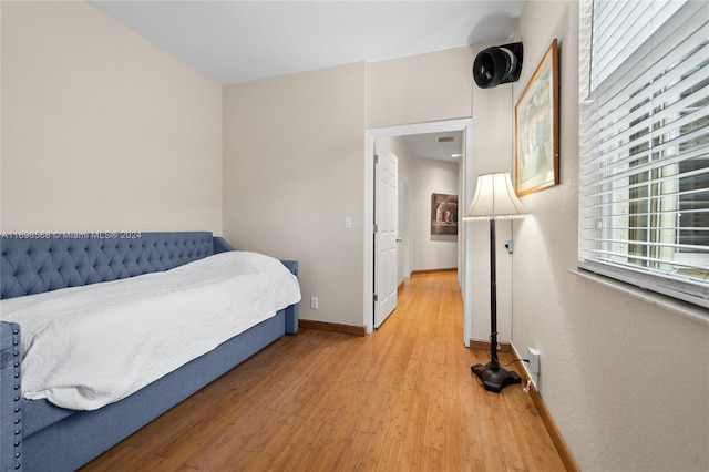 bedroom with light wood-type flooring