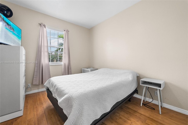 bedroom featuring wood-type flooring