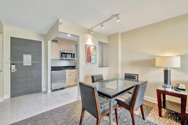 dining room featuring light tile patterned flooring