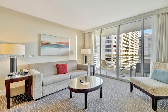 living room with carpet and floor to ceiling windows