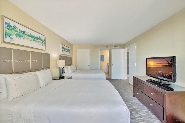 bedroom featuring dark colored carpet