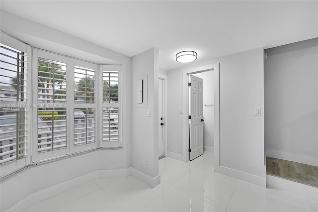 hallway featuring light tile patterned floors