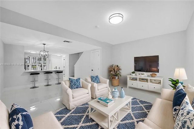 living room with an inviting chandelier