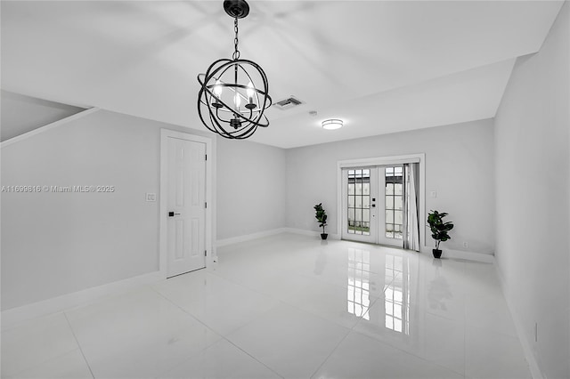 interior space with an inviting chandelier, tile patterned flooring, and french doors