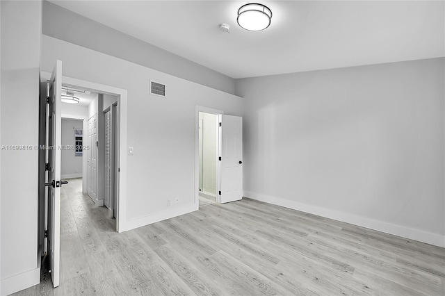 unfurnished bedroom featuring light wood-type flooring