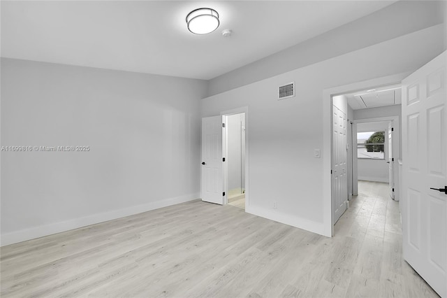 unfurnished bedroom with light wood-type flooring