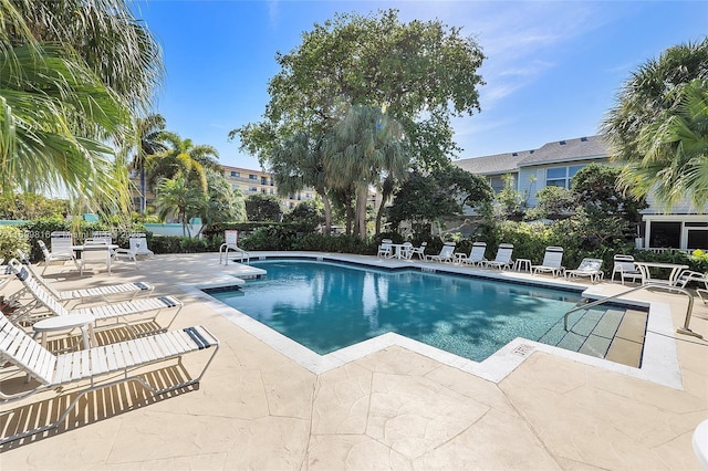 view of swimming pool featuring a patio area