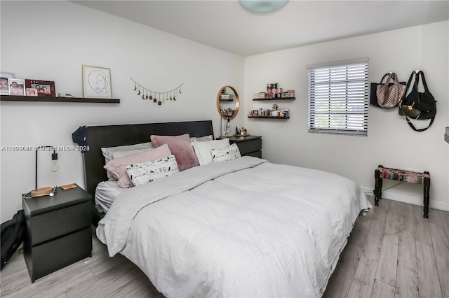 bedroom featuring light wood-type flooring