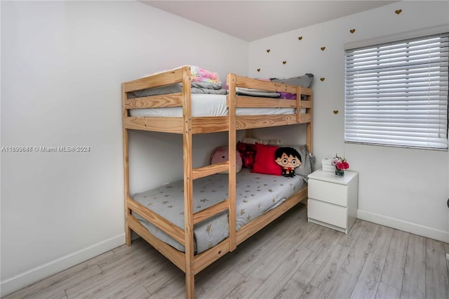 bedroom with light hardwood / wood-style flooring