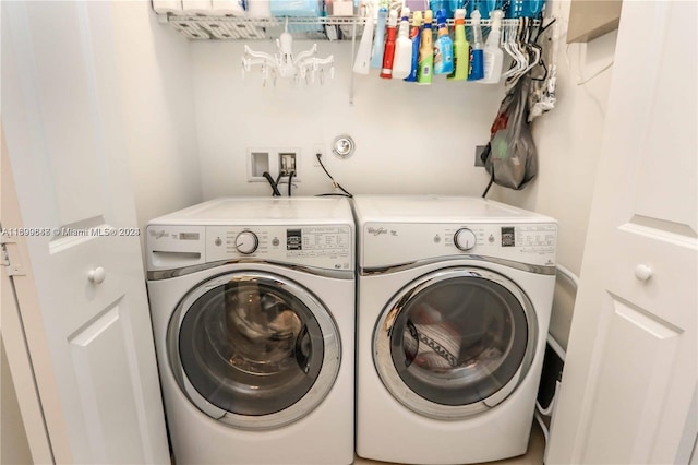 clothes washing area featuring washing machine and dryer