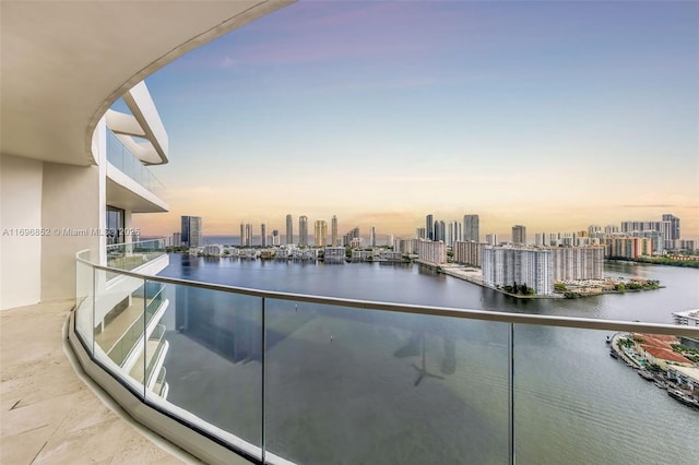 balcony at dusk with a water view