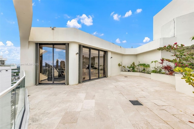 view of patio featuring a balcony