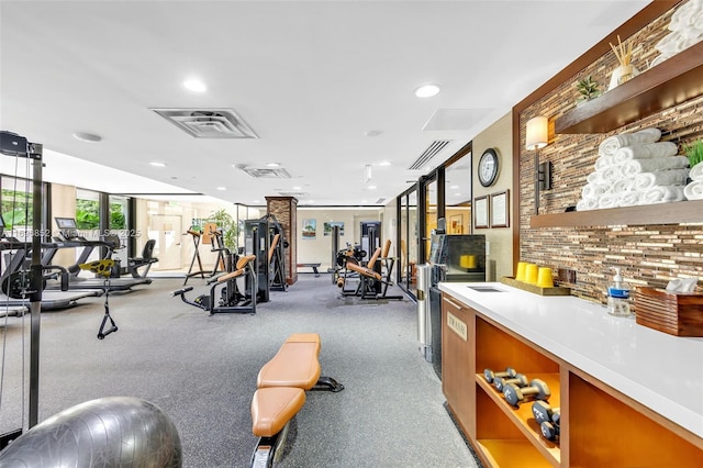 exercise room featuring expansive windows