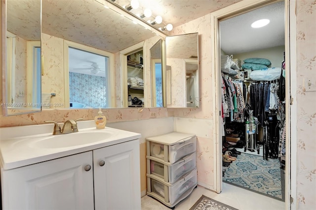 bathroom with tile patterned flooring and vanity