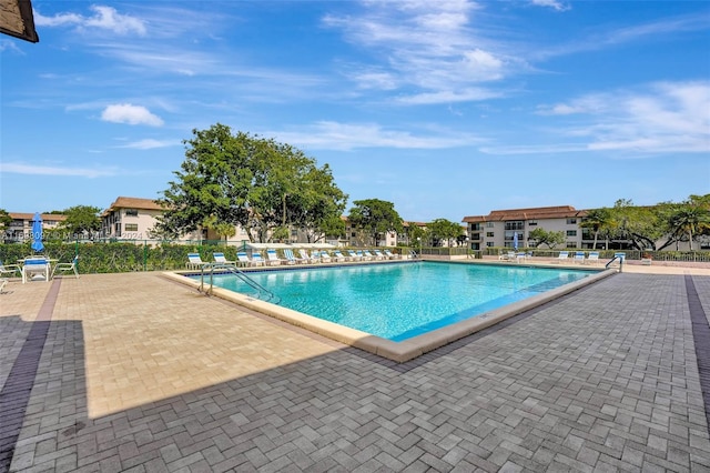 view of swimming pool featuring a patio