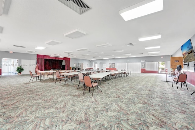 dining space with light colored carpet