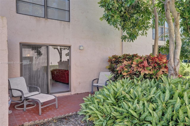 entrance to property with a patio