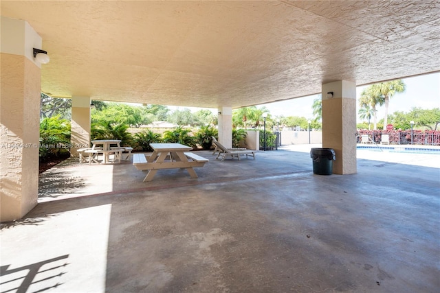 view of patio / terrace with a fenced in pool