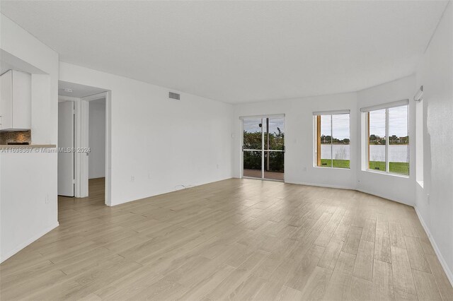 empty room with light wood-type flooring