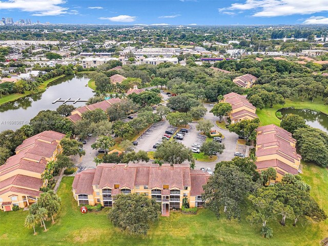 birds eye view of property featuring a water view