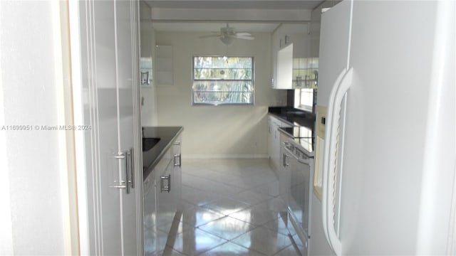 kitchen featuring white cabinets, light tile patterned floors, white appliances, and ceiling fan