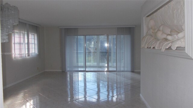 spare room with tile patterned floors