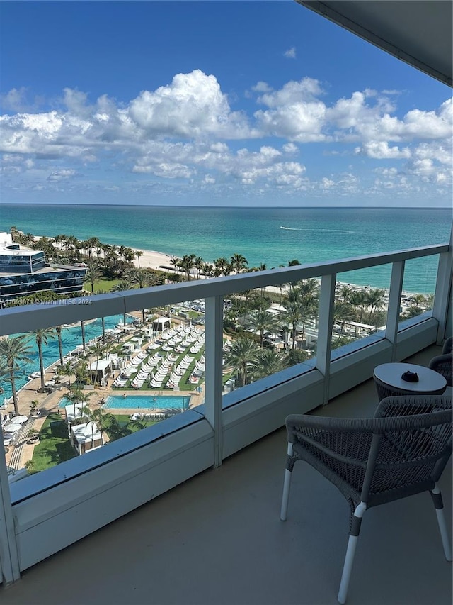 balcony with a view of the beach and a water view