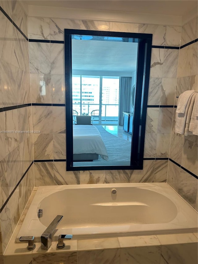 bathroom with tiled tub