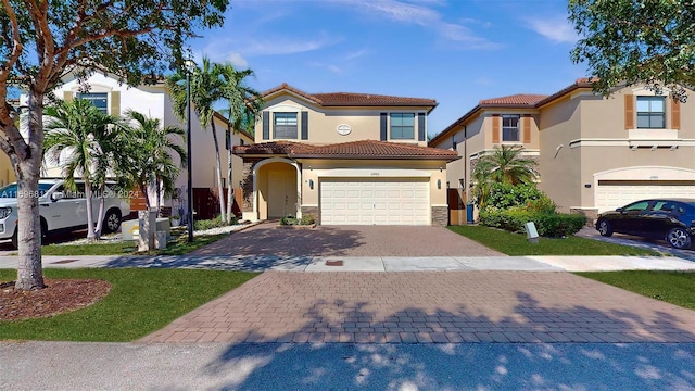 mediterranean / spanish house featuring a garage