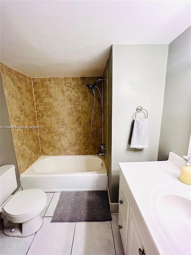 full bathroom featuring toilet, vanity, tiled shower / bath combo, and tile patterned floors