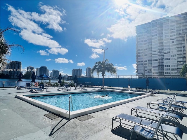 view of swimming pool with a patio