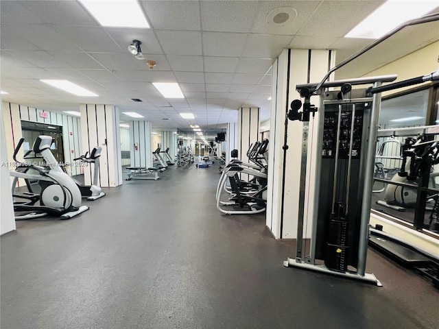 gym featuring a paneled ceiling