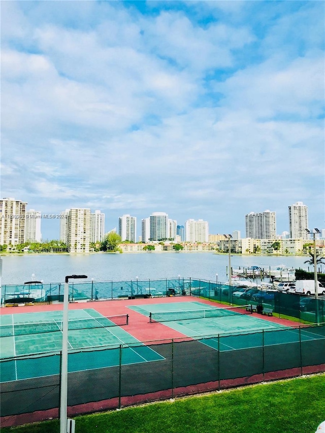 view of sport court featuring a water view