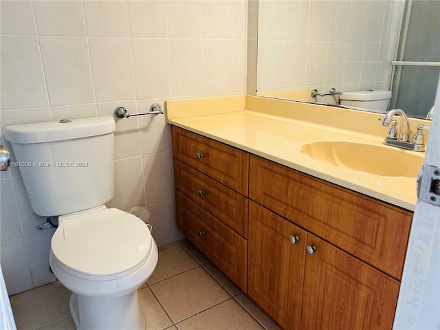 bathroom featuring tile patterned floors and tile walls