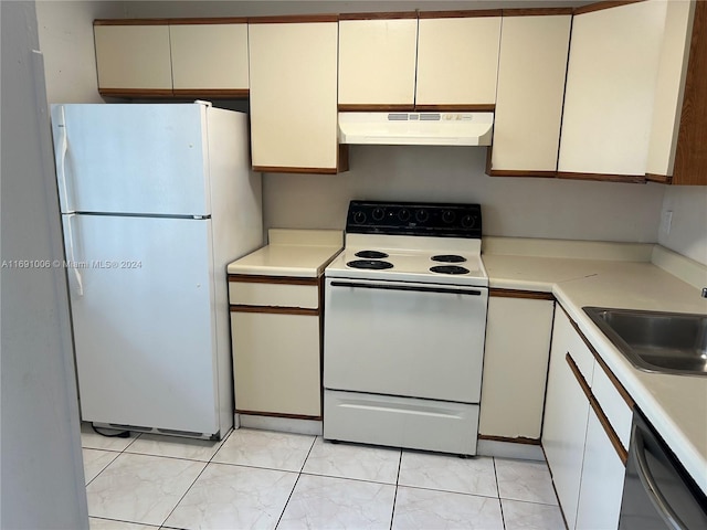 kitchen featuring white appliances and sink