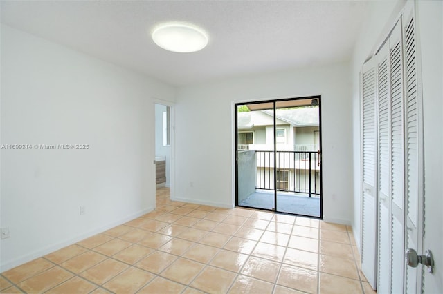 empty room with light tile patterned floors