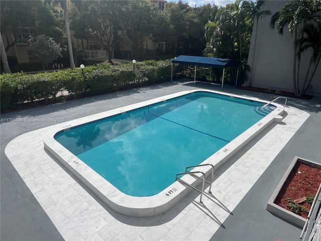 view of swimming pool featuring a patio area