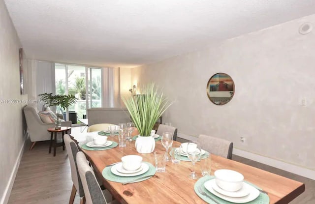 dining space featuring hardwood / wood-style flooring