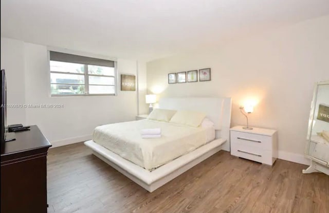 bedroom featuring light hardwood / wood-style flooring