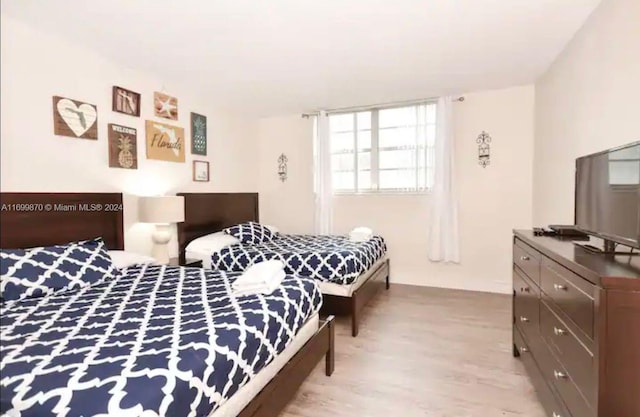 bedroom with light hardwood / wood-style floors