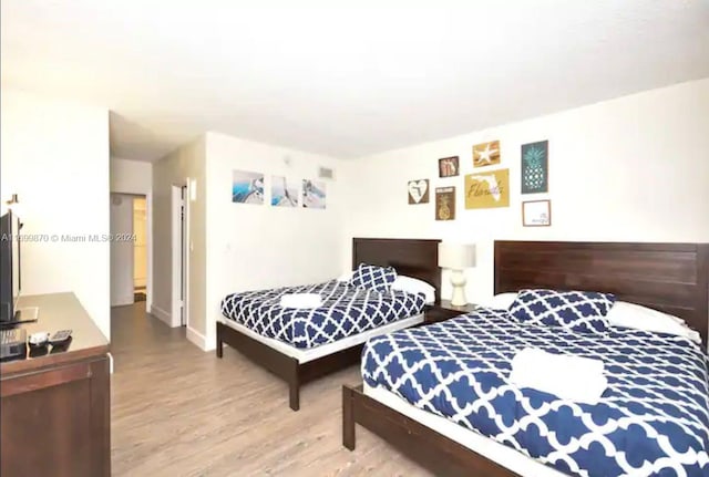 bedroom featuring light hardwood / wood-style flooring