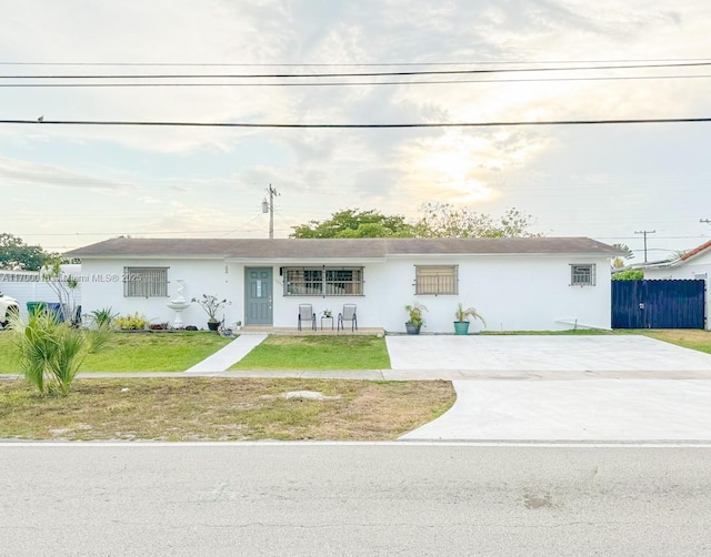 ranch-style home with a front yard