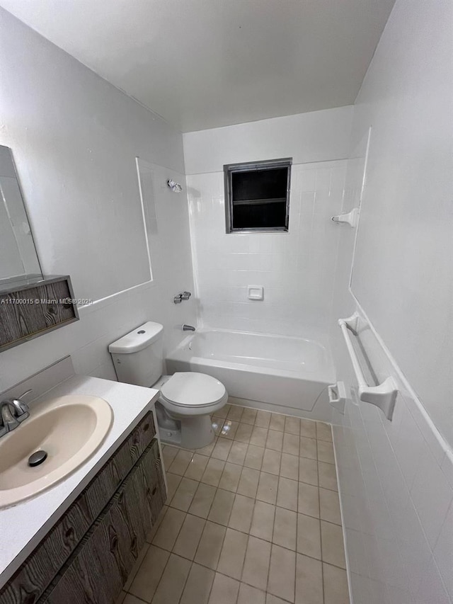 full bathroom featuring tile patterned floors, vanity, bathtub / shower combination, and toilet