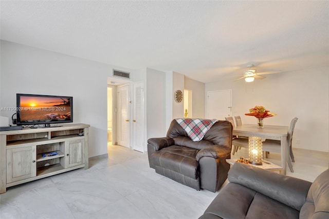 living room with ceiling fan