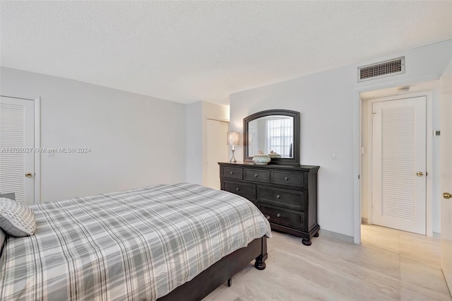 bedroom featuring a textured ceiling