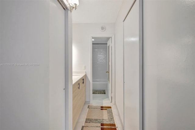 bathroom featuring tile patterned flooring and vanity