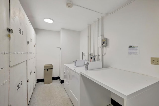 clothes washing area featuring washing machine and dryer