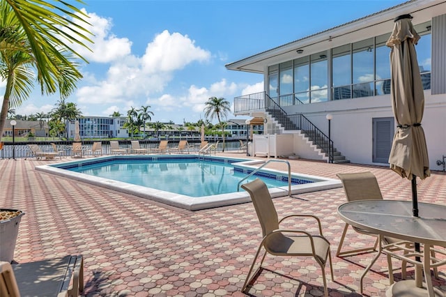 view of swimming pool with a patio